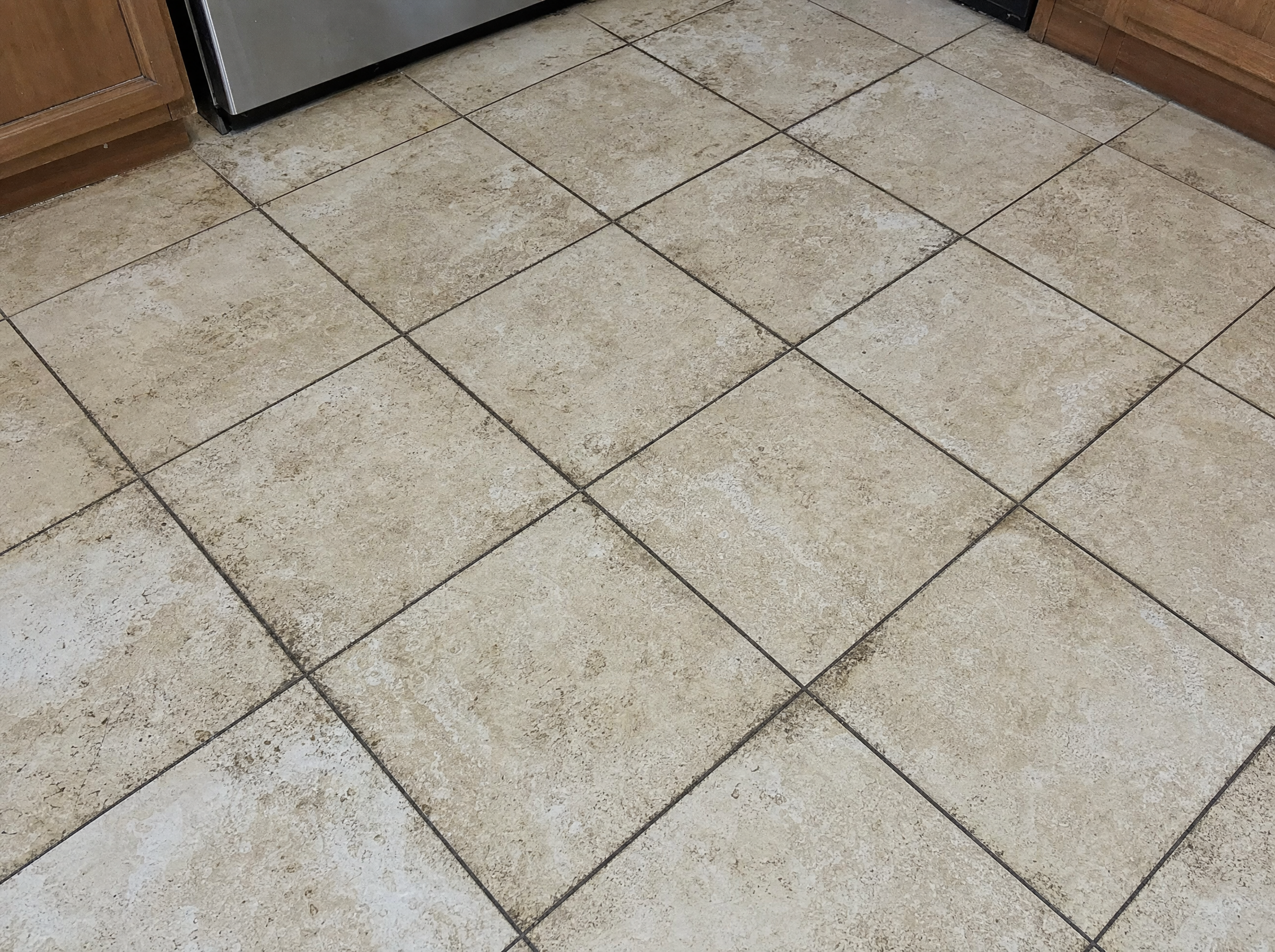 Dirty tile and grout before cleaning